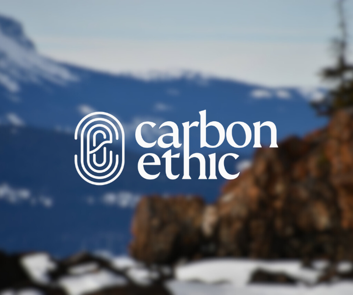 Site photo from the Dene K'éh Kusān Forest IFM Carbon Project with Carbonethic logo overlay